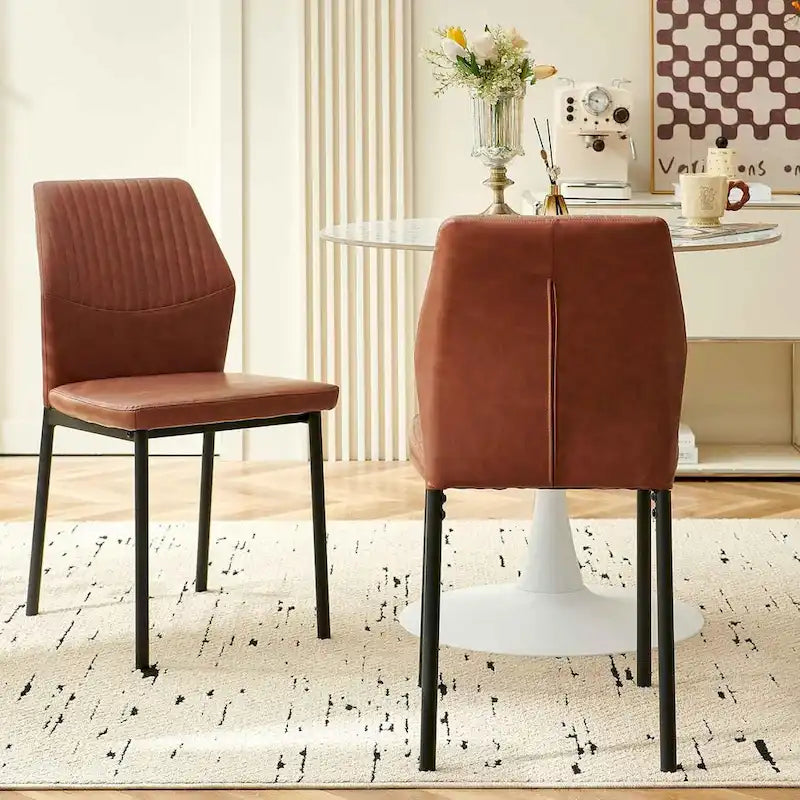 Sedia da pranzo imbottita con ecopelle e gambe in metallo